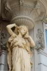 Vienna, Austria. Goddess statue on building exterior. Art Print